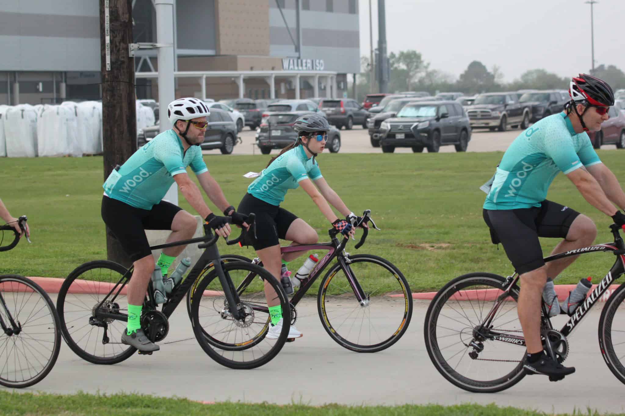 Cyclists riding together for Bluebonnet Express cycling event promotion.
