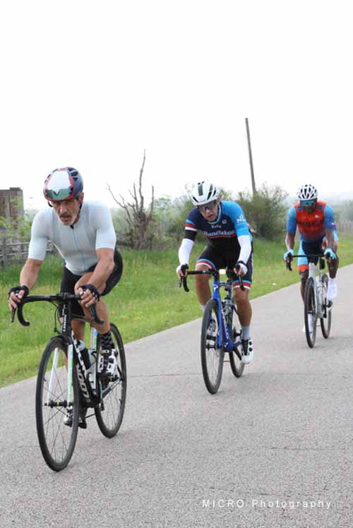A group of cyclists riding together during the Bluebonnet Express bike event, showcasing endurance and teamwork in scenic Texas landscape.