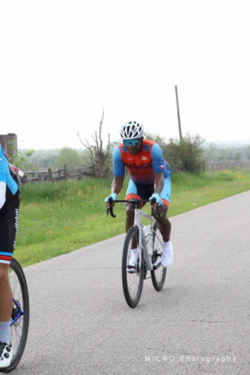 High-performance cyclist on Bluebonnet Express bike route during race or ride event.