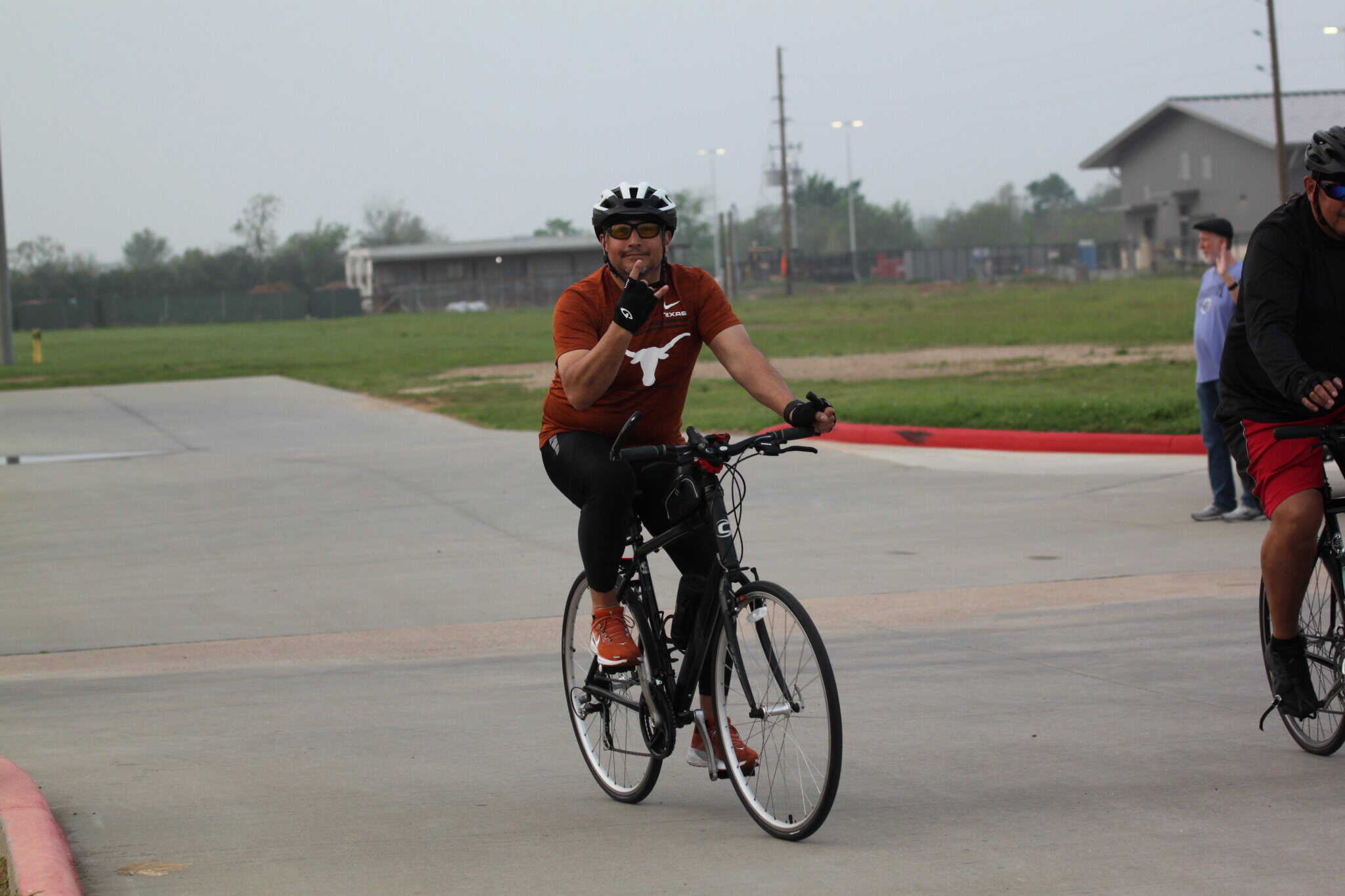 Vast cycling event organized by Bluebonnet Express featuring enthusiastic riders on a cloudy day.