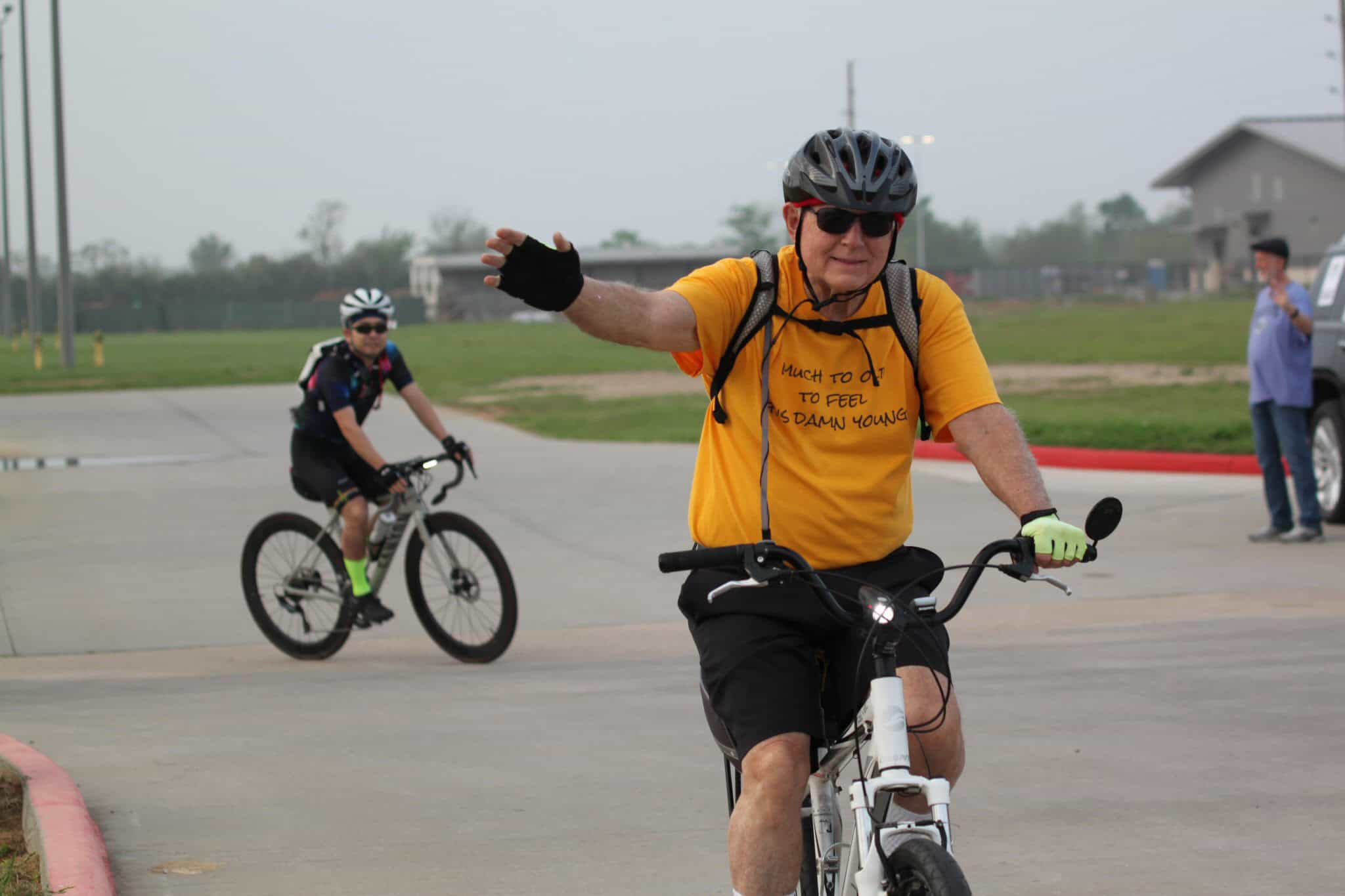Enjoying a scenic ride on Bluebonnet Express bike trail with active cyclists and beautiful park scenery.