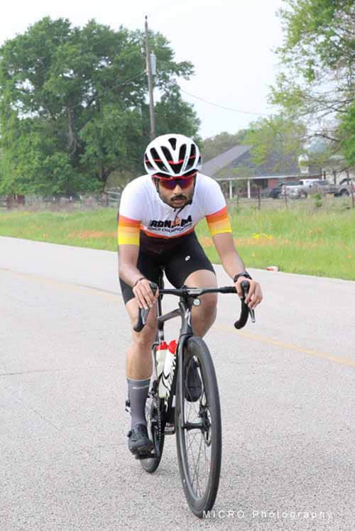 Cyclist riding on the road during Bluebonnet Express cycling event, showcasing endurance and outdoor adventure.