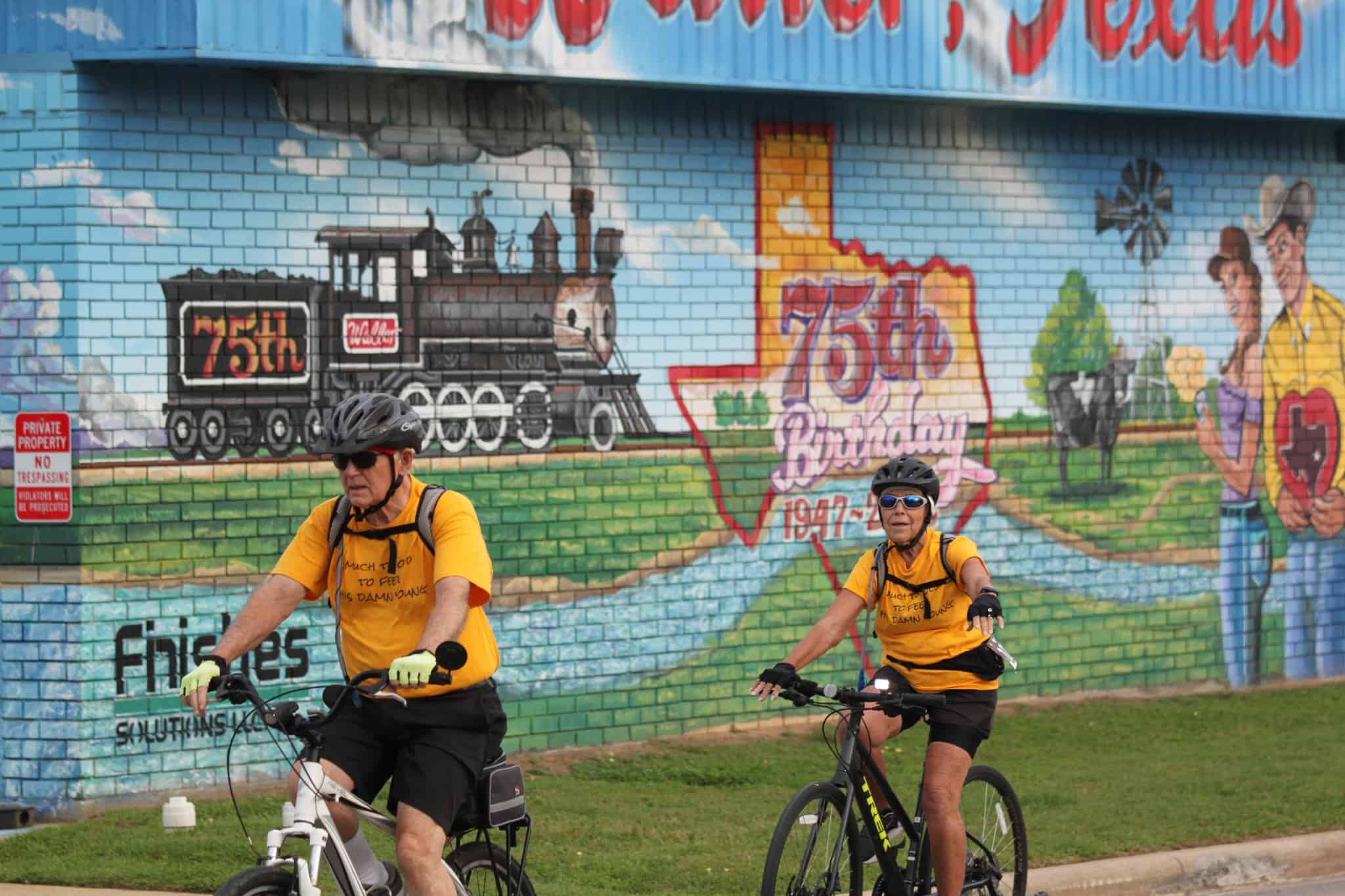 Colorful mural celebrating 75th birthday of Bluebonnet Express train in Texas.