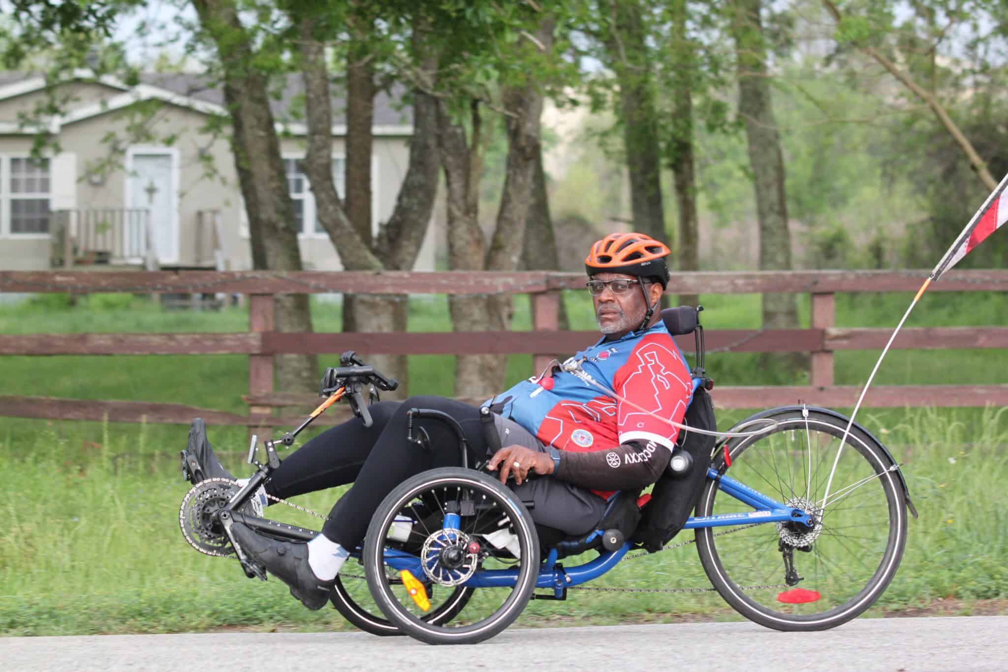 Handcycle rider enjoying scenic view on Bluebonnet Express bike trail in Texas.