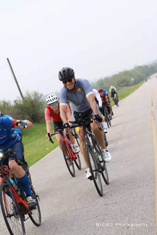 Enjoying a group bike ride on the Bluebonnet Express trail for cycling enthusiasts.