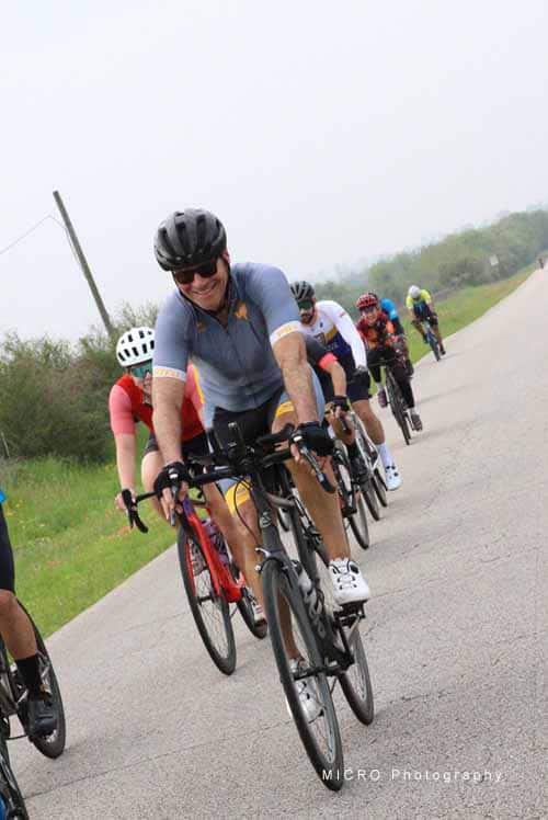Brighton cycling group enjoying a ride on scenic country roads during Bluebonnet Express event.