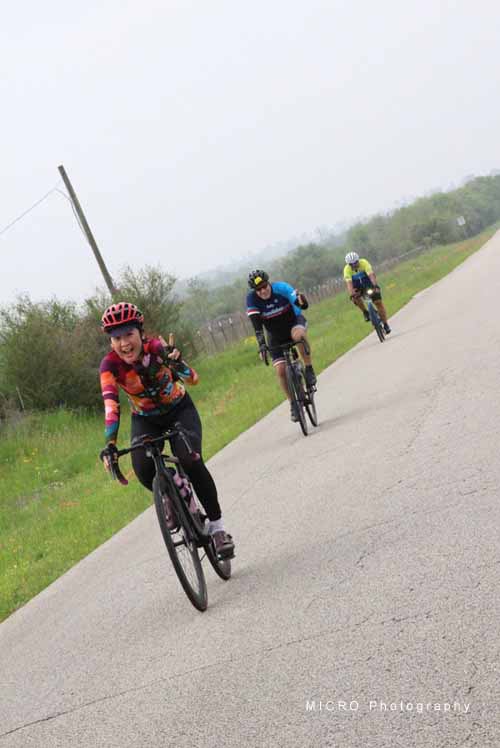 1. Kids riding bikes on rural road, Bluebonnet Express cycling event.