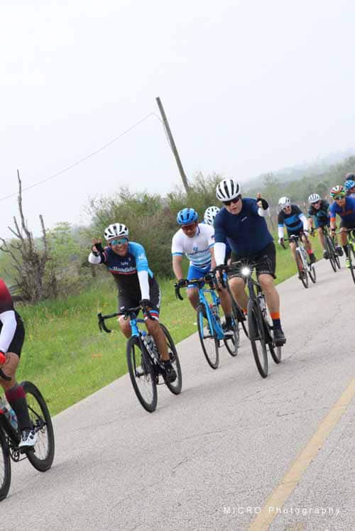Cyclists riding the Bluebonnet Express event on a scenic outdoor route.