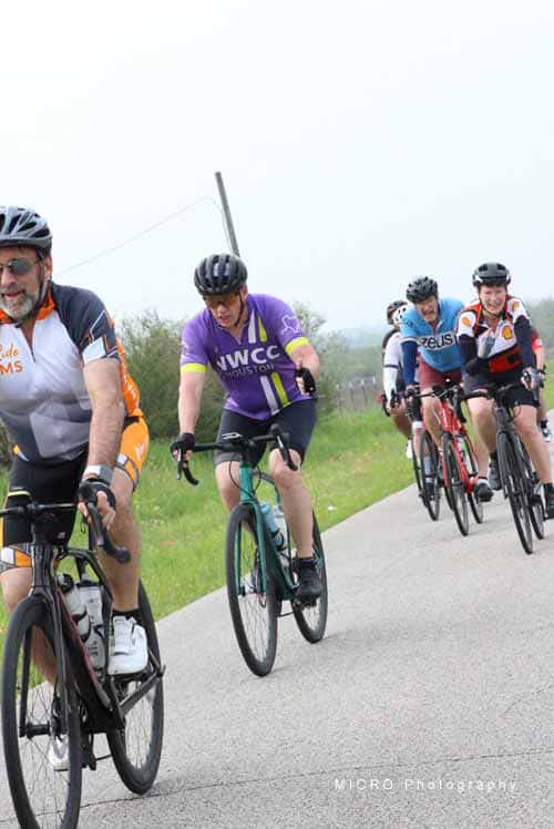 Cycling group riding on scenic trail during Bluebonnet Express event in Texas.