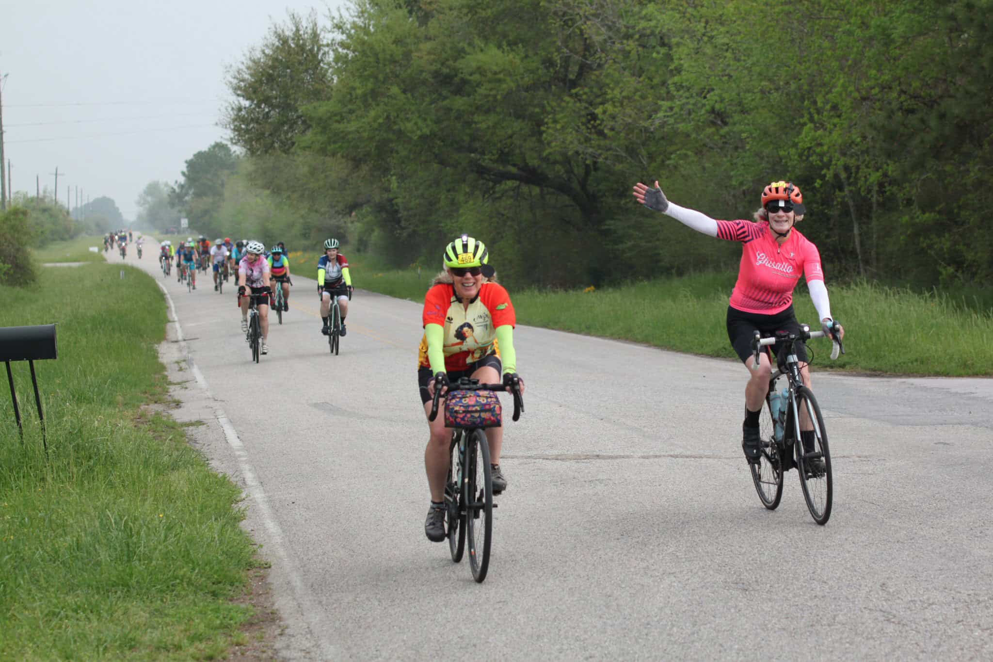 Enjoying the Bluebonnet Express cycling event with cheerful riders on scenic rural roads.