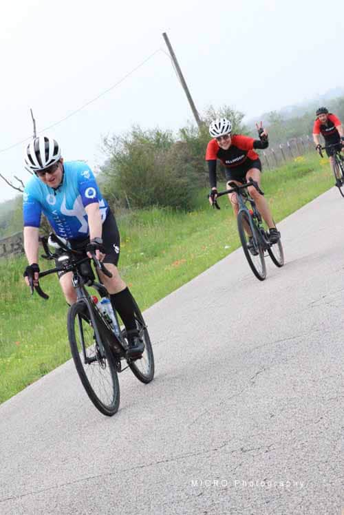 Cycling race during Bluebonnet Express event, Texas, group of cyclists biking on rural road for health and sport competition.
