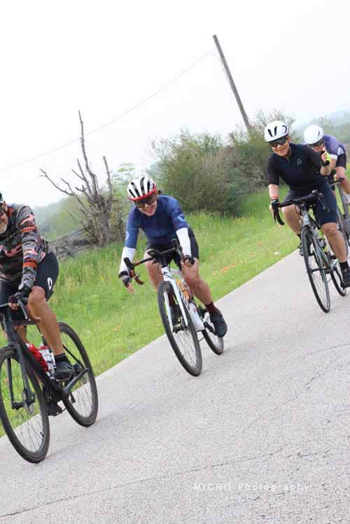 Smooth group cycling ride on the Bluebonnet Express route in scenic countryside.