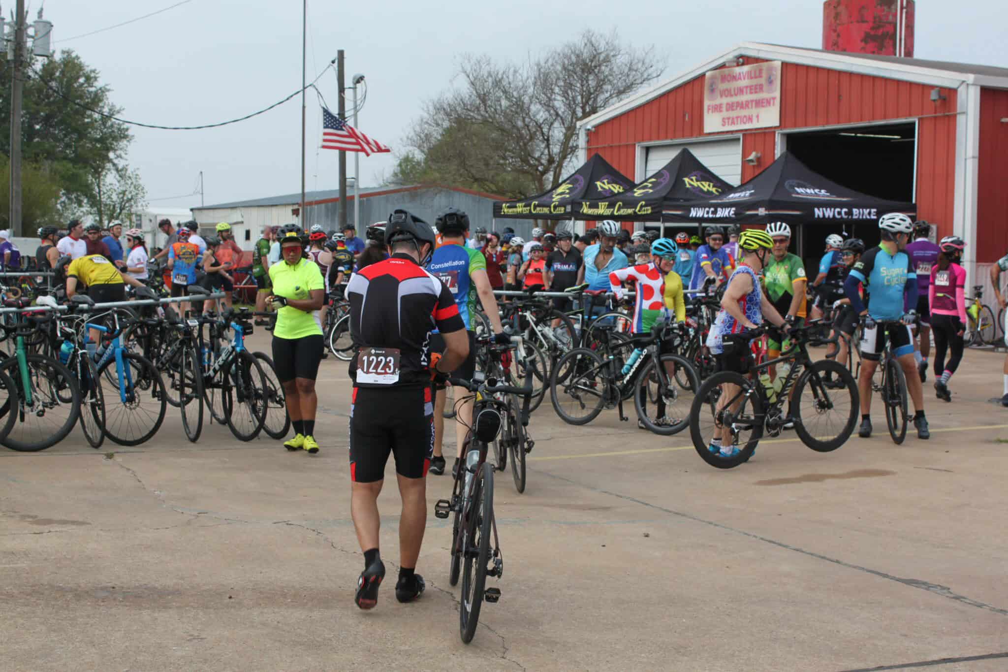 Bicycle riders gathering at Bluebonnet Express cycling event, Texas, for a fun and active day.