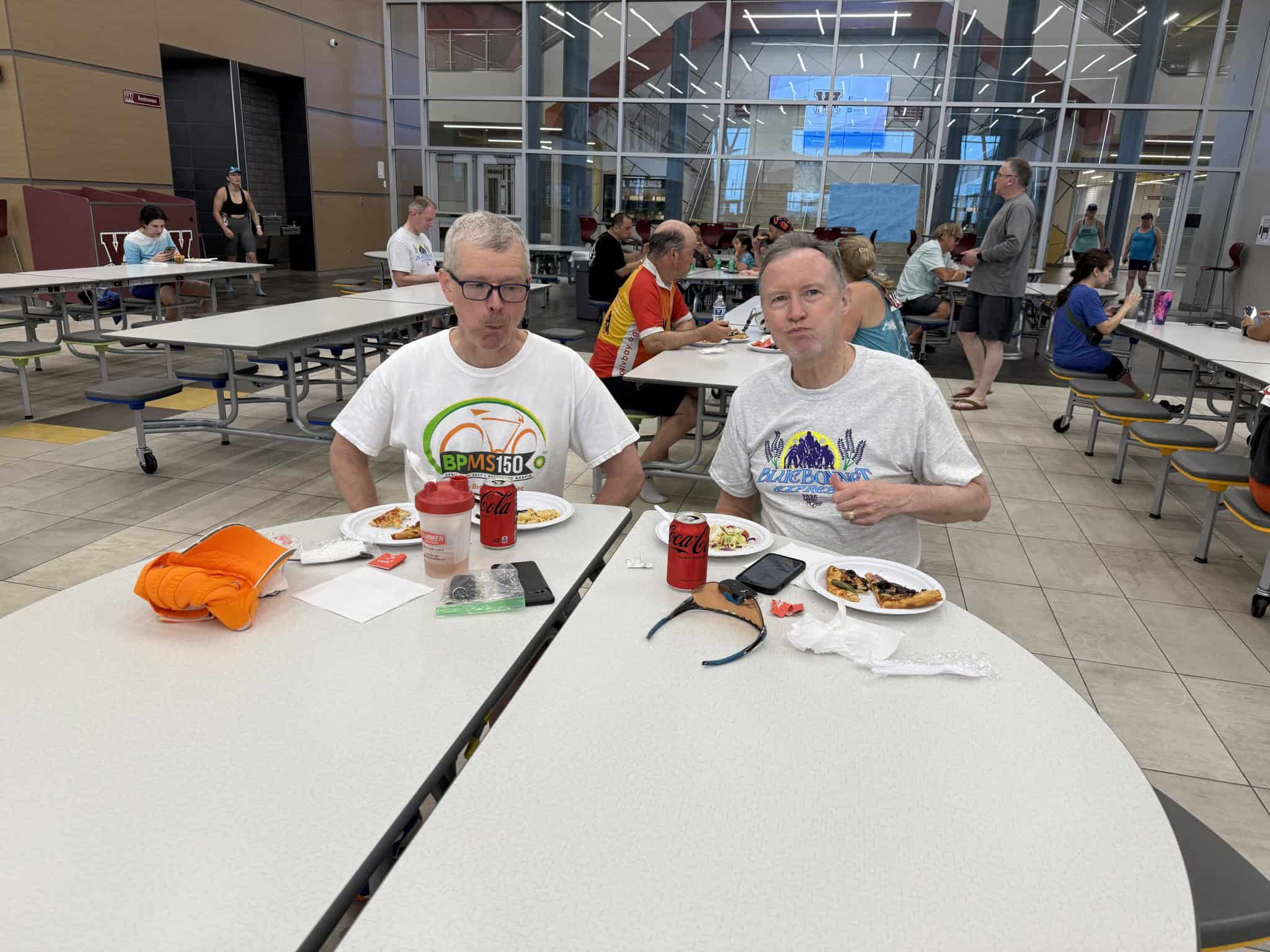 Bike-themed event lunch at Bluebonnet Express, vibrant atmosphere with cyclists enjoying meals.