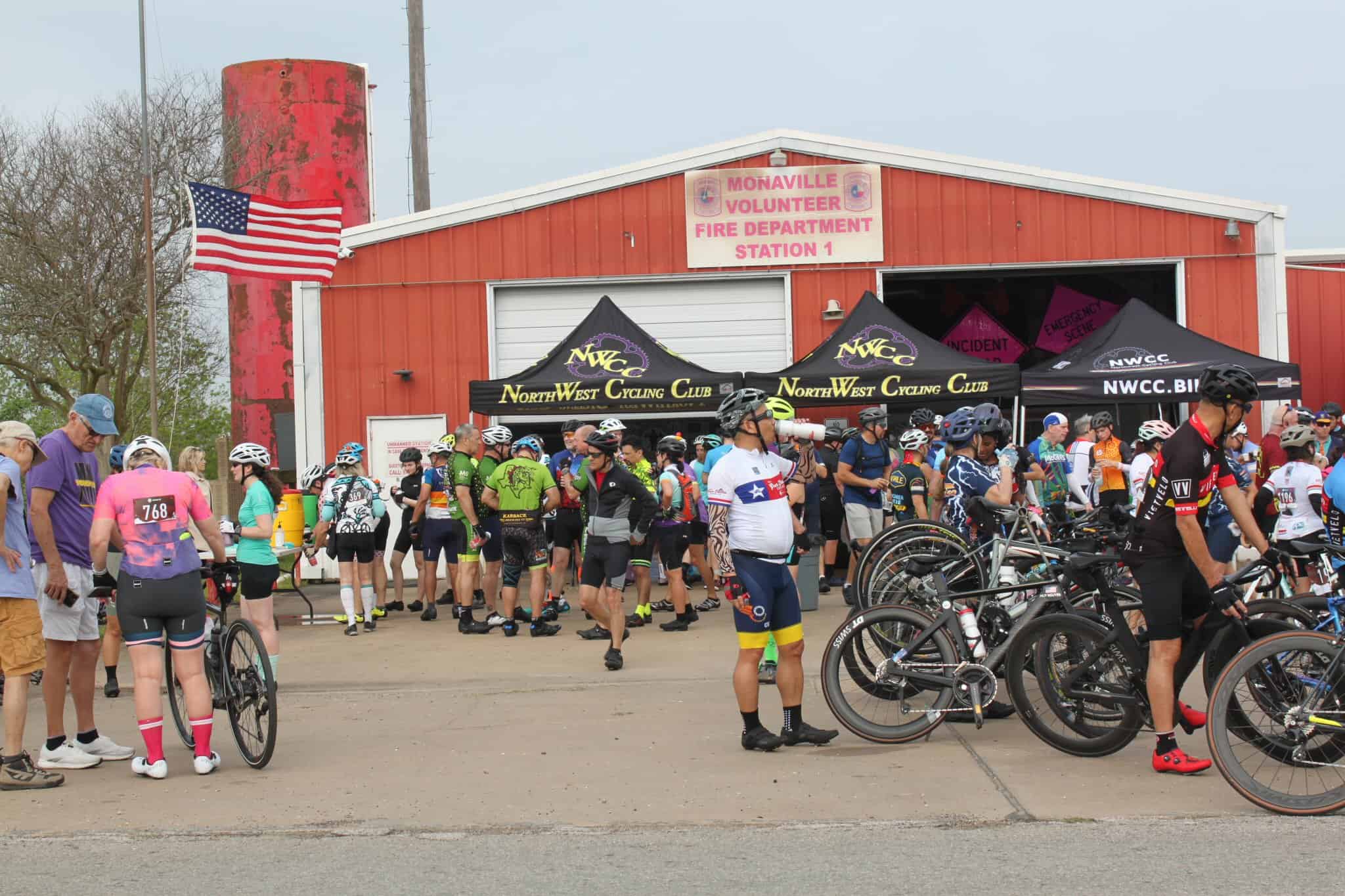 Cyclists gather at NorthWest Cycling Club event near Monaville Volunteer Fire Department.