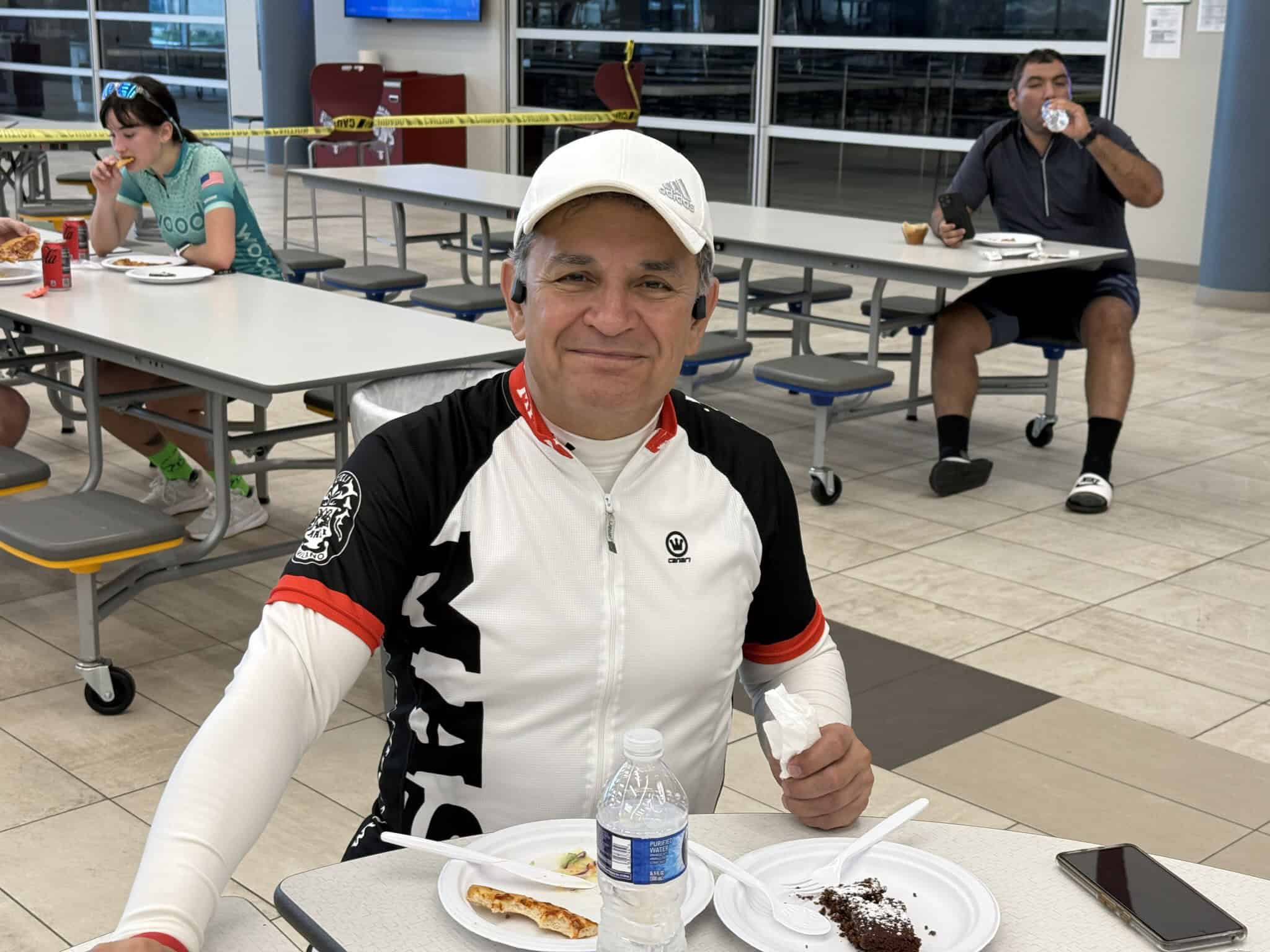Bright cyclist enjoying a meal at a Bluebonnet Express station after a bike ride.