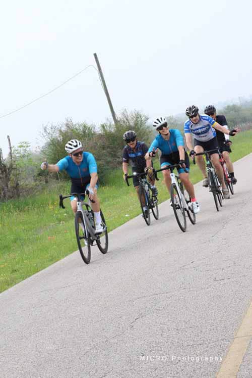 Enjoying a group bike ride on scenic rural roads with Bluebonnet Express cycling team.