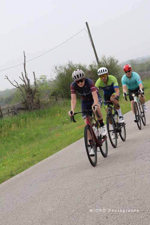 Biking on scenic country road with Bluebonnets during daytime.