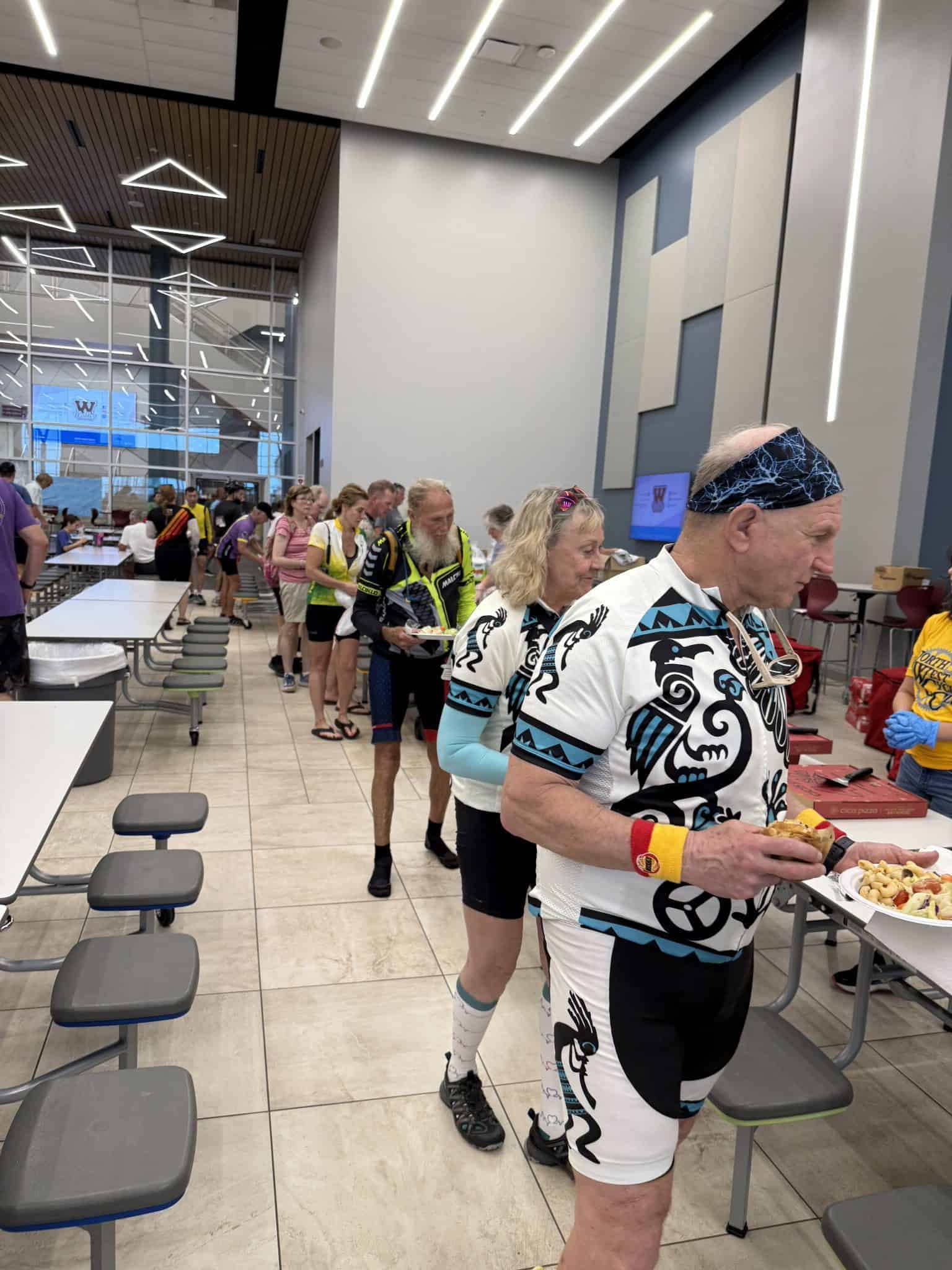 Bright bluebonnet-themed cycling jerseys at Bluebonnet Express event, showcasing community spirit and race-day camaraderie.