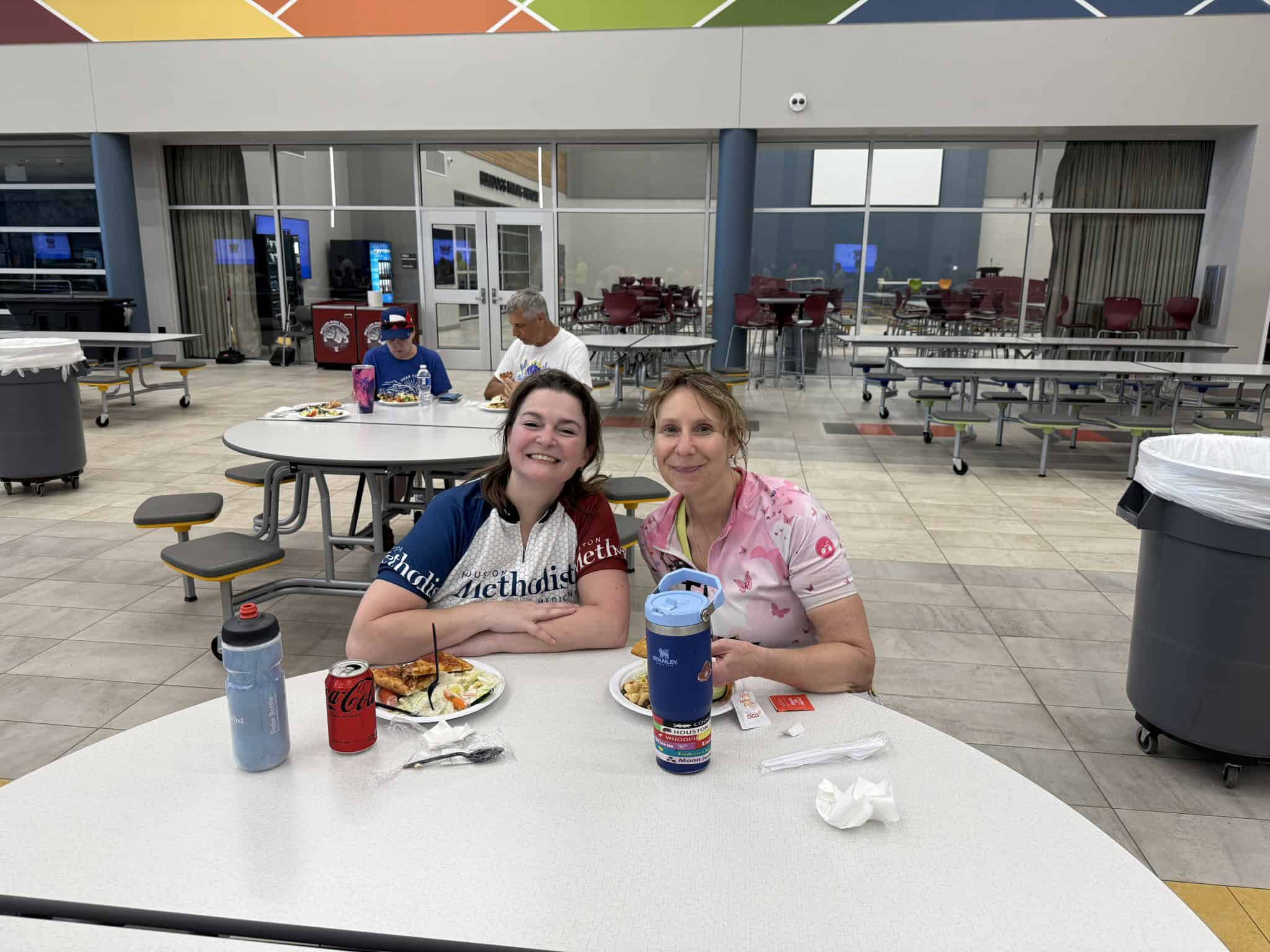 Comfortable Bluebonnet Express bus station dining area with people enjoying meals and drinks.