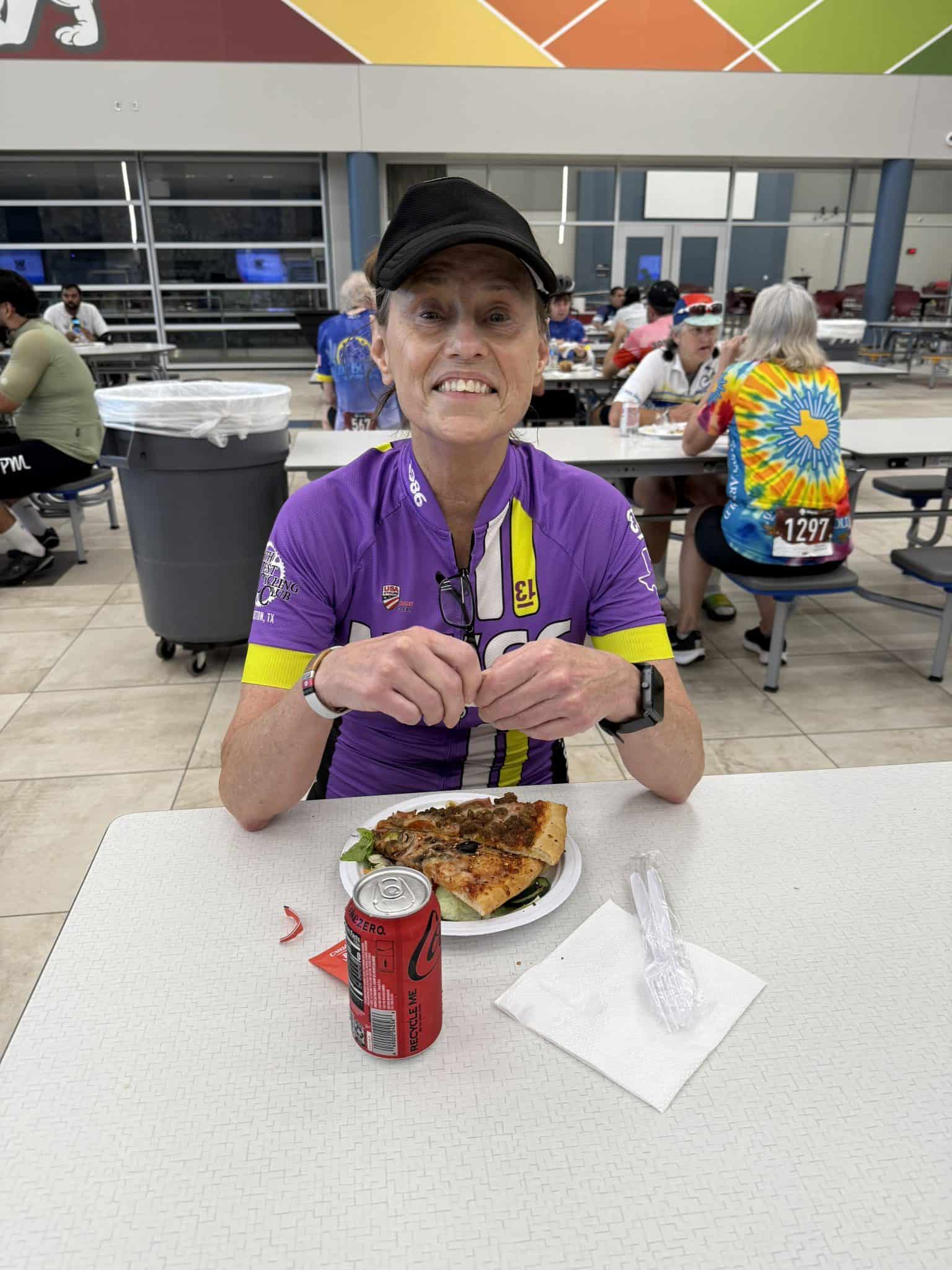 Famous woman cyclist enjoying meal at Bluebonnet Express event, showcasing active lifestyle and dedication to cycling.