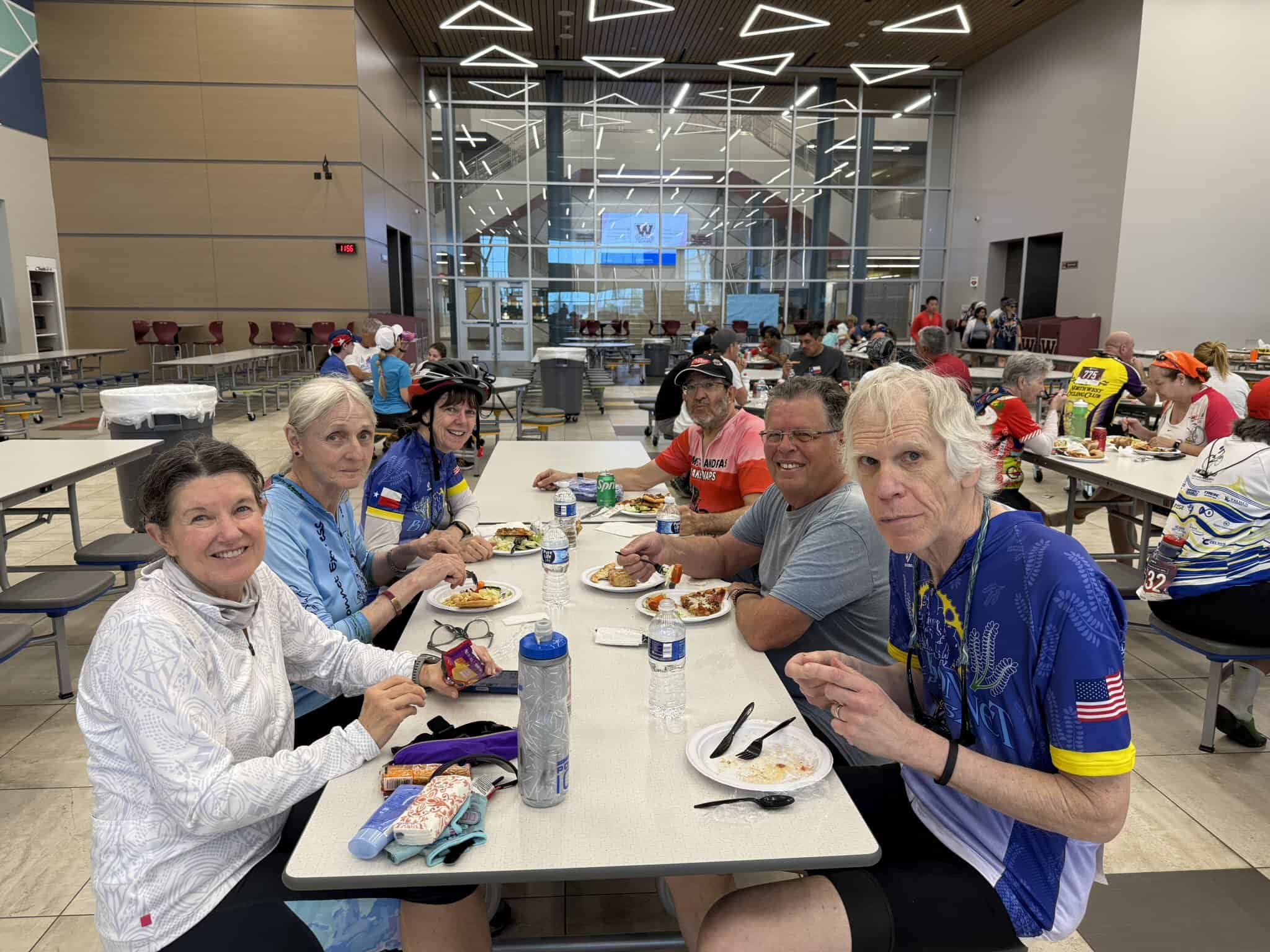 Enjoying a meal at Bluebonnet Express after a cycling event, showcasing a vibrant community of cyclists.