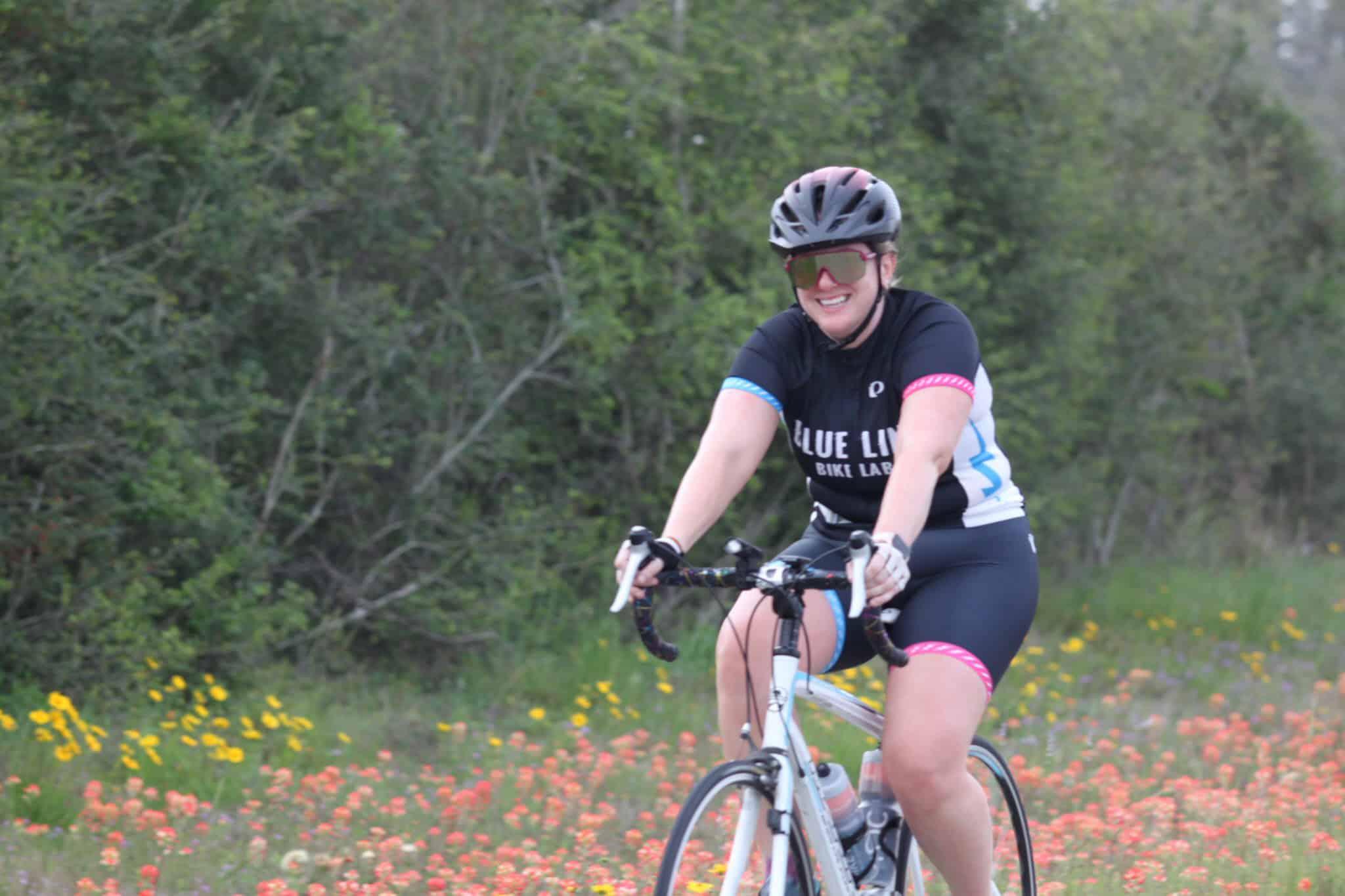 Vibrant cyclist enjoying scenic trail on Bluebonnet Express bike route in Texas.
