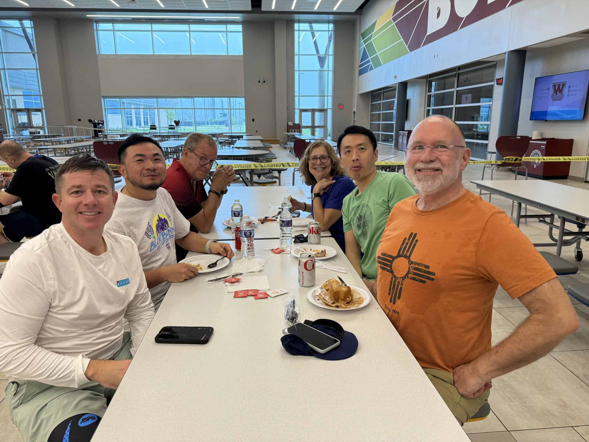 Enjoying a meal at Bluebonnet Express with a diverse group of cyclists after a biking event. Great food and camaraderie in a bright, spacious setting.