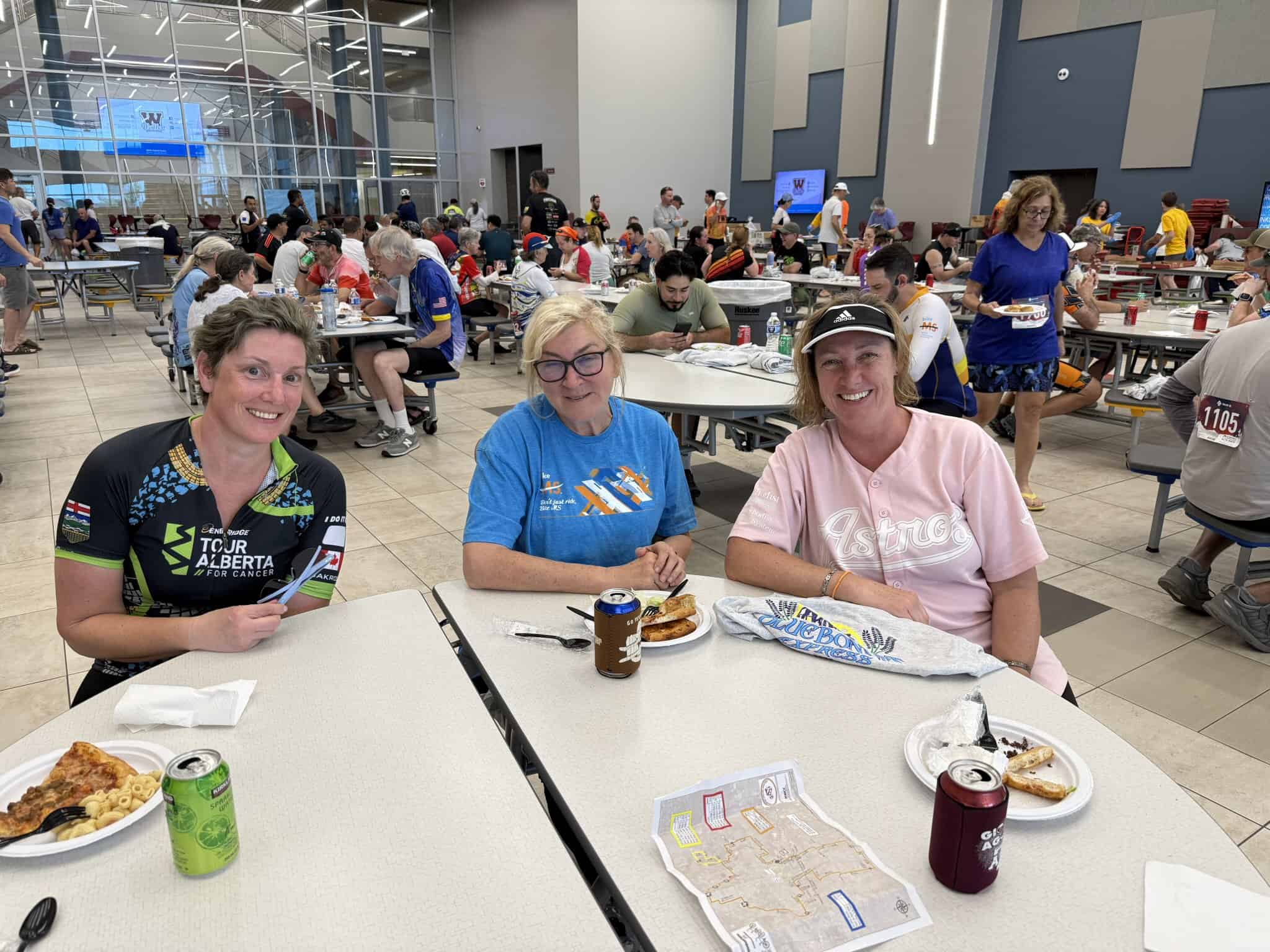 Cyclists enjoying a meal at the Bluebonnet Express event, promoting cycling and fitness in Texas.