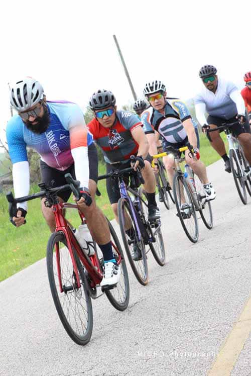 Stable cycling team ride at Bluebonnet Express event outdoors.
