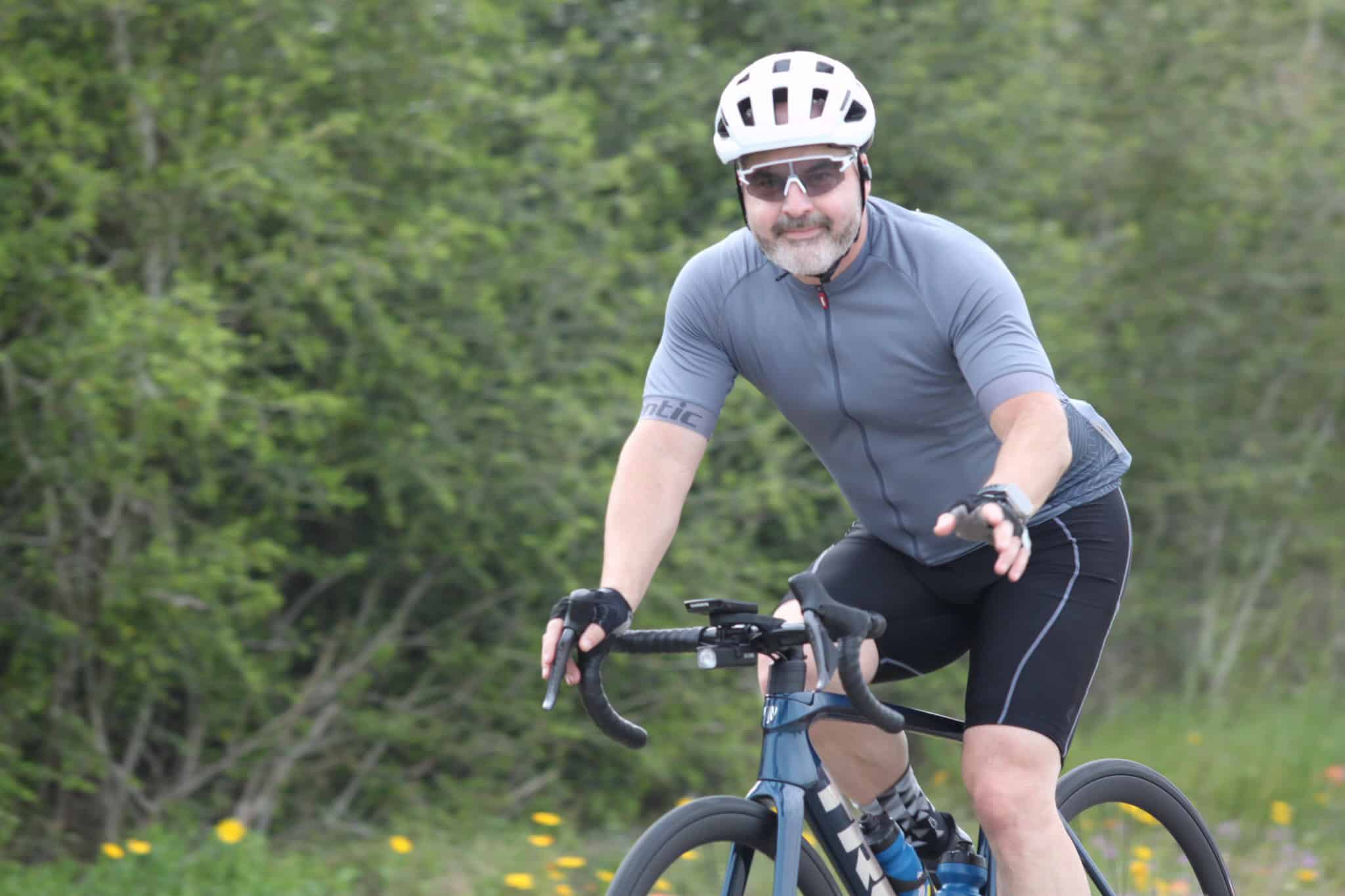 Rider enjoying a scenic bike ride on Bluebonnet Express trail in Texas.