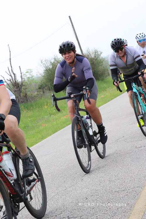 Cyclist on Bluebonnet Express ride enjoying scenic Texas countryside.