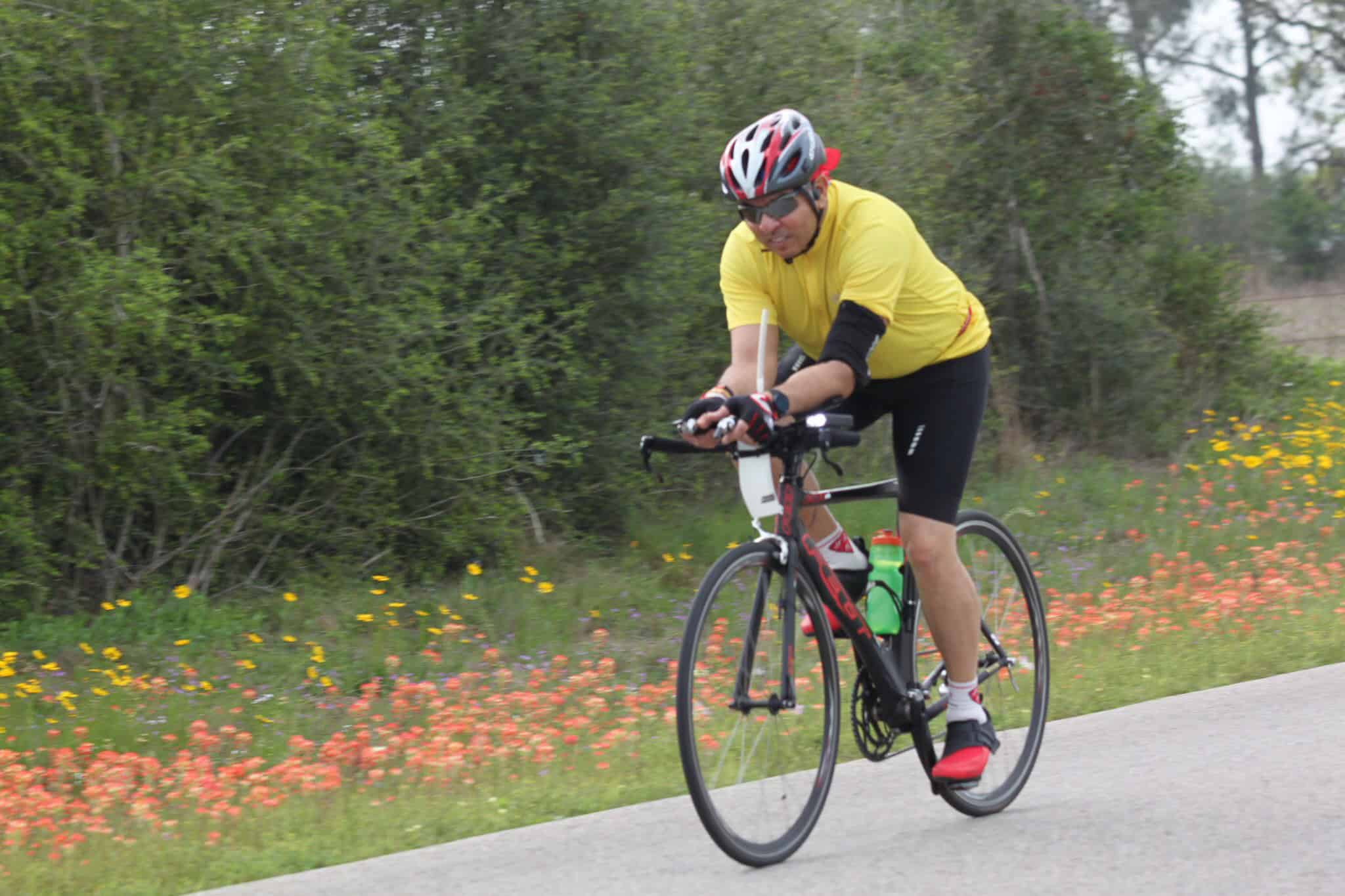 Smooth riding cyclist on scenic park trail, Bluebonnet Express cycling adventure.