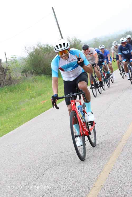 Smooth road cycling race at Bluebonnet Express with enthusiastic cyclists enjoying Texas scenery.