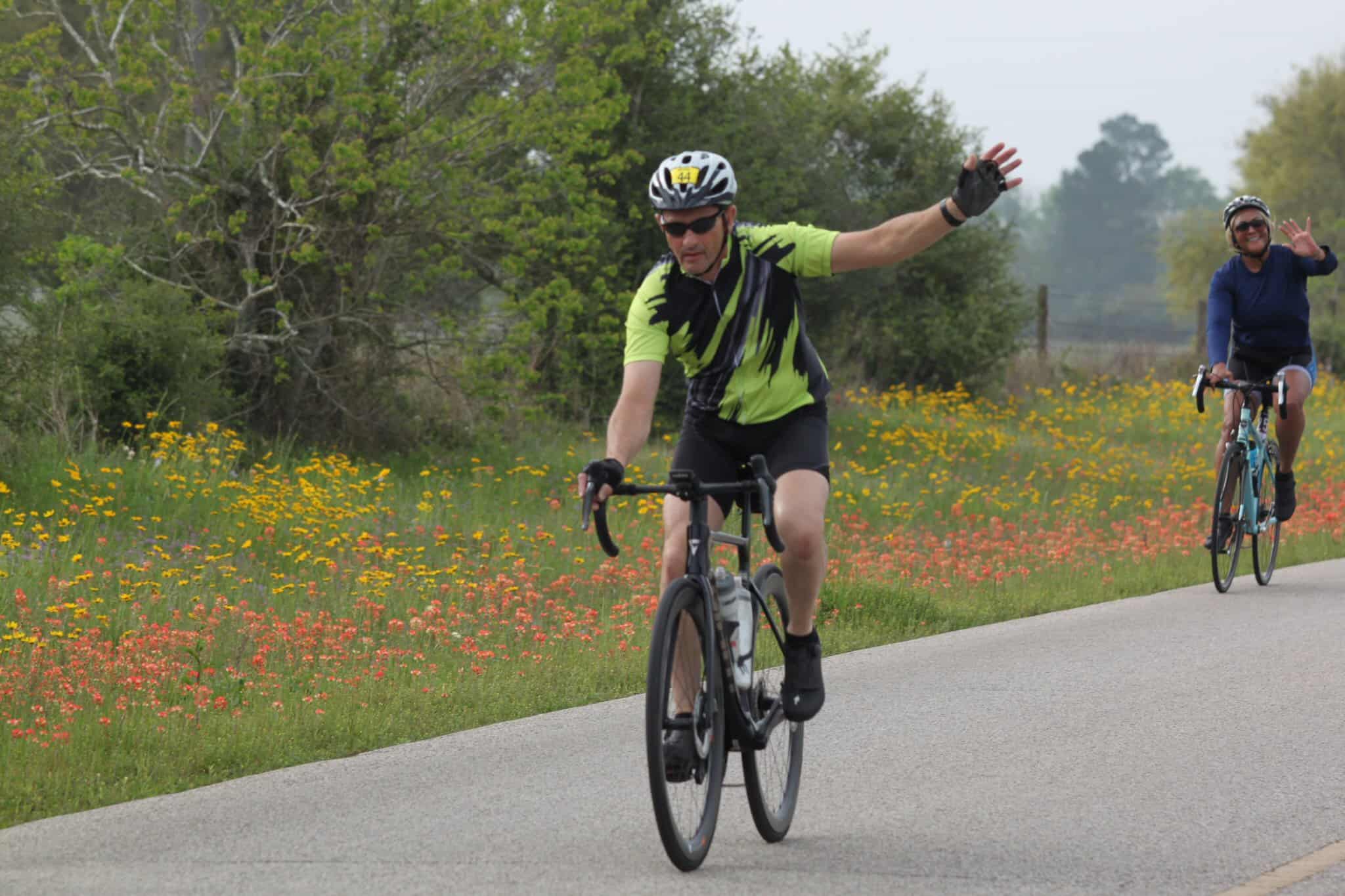 Vibrant Texas bluebonnet flower fields with cyclists enjoying outdoor adventure.