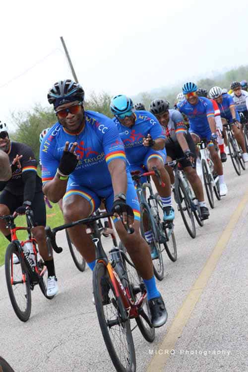 Bright blue cyclist jerseys at Bluebonnet Express cycling event, celebrating racing and outdoor biking.