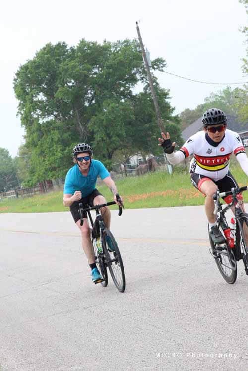 VietVelo cyclists enjoying a ride on the Bluebonnet Express route in scenic Texas countryside.