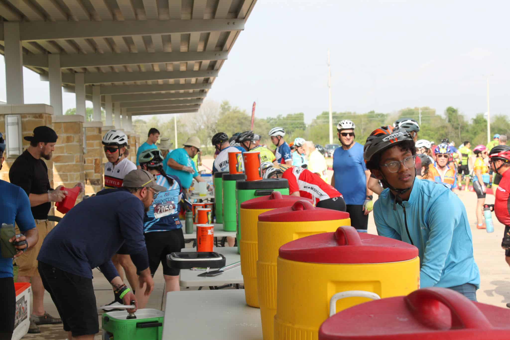 Refreshing water station at Bluebonnet Express cycling event for cyclists and participants.