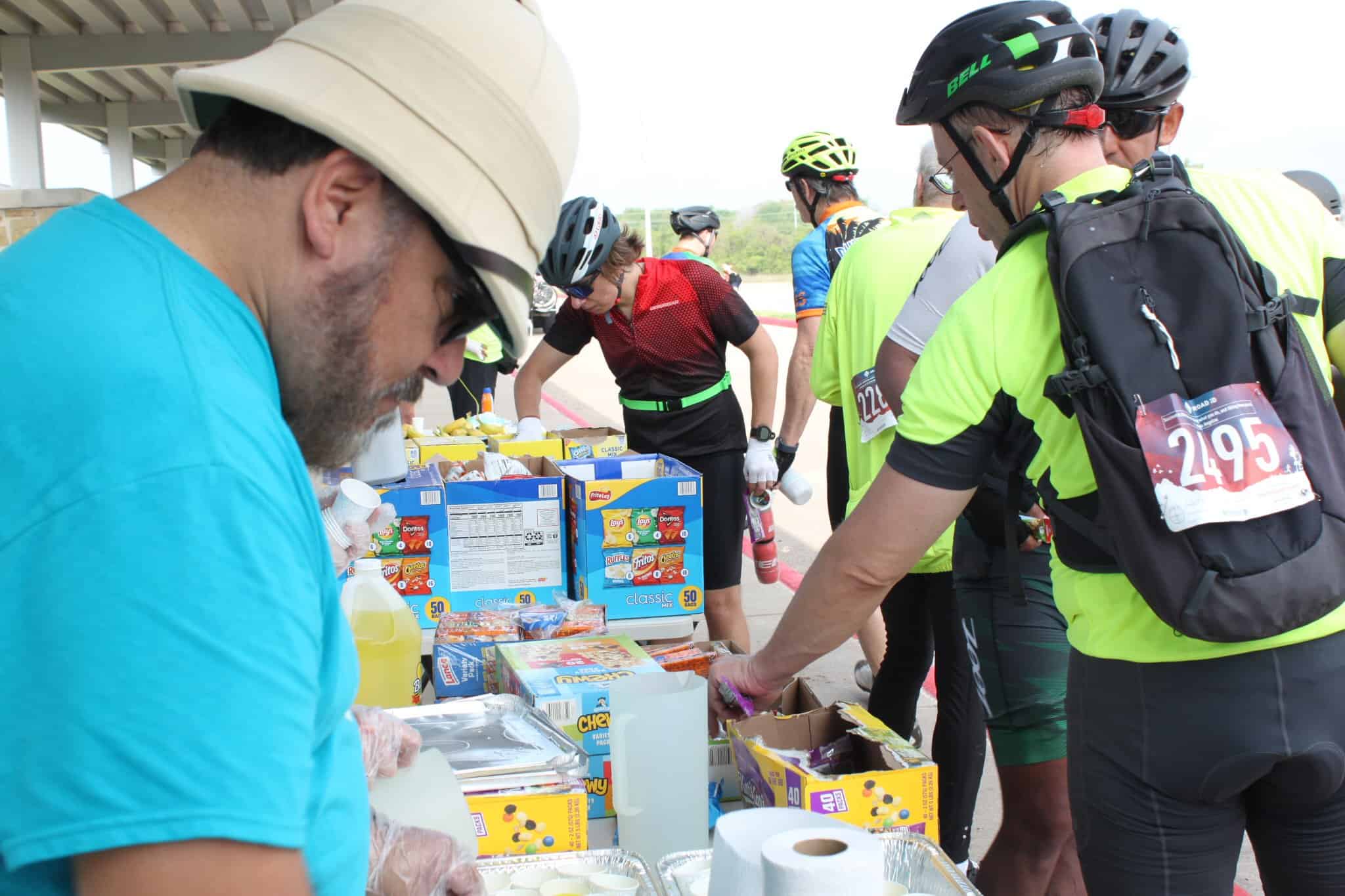Energy-filled charity bike race snack station at Bluebonnet Express event.