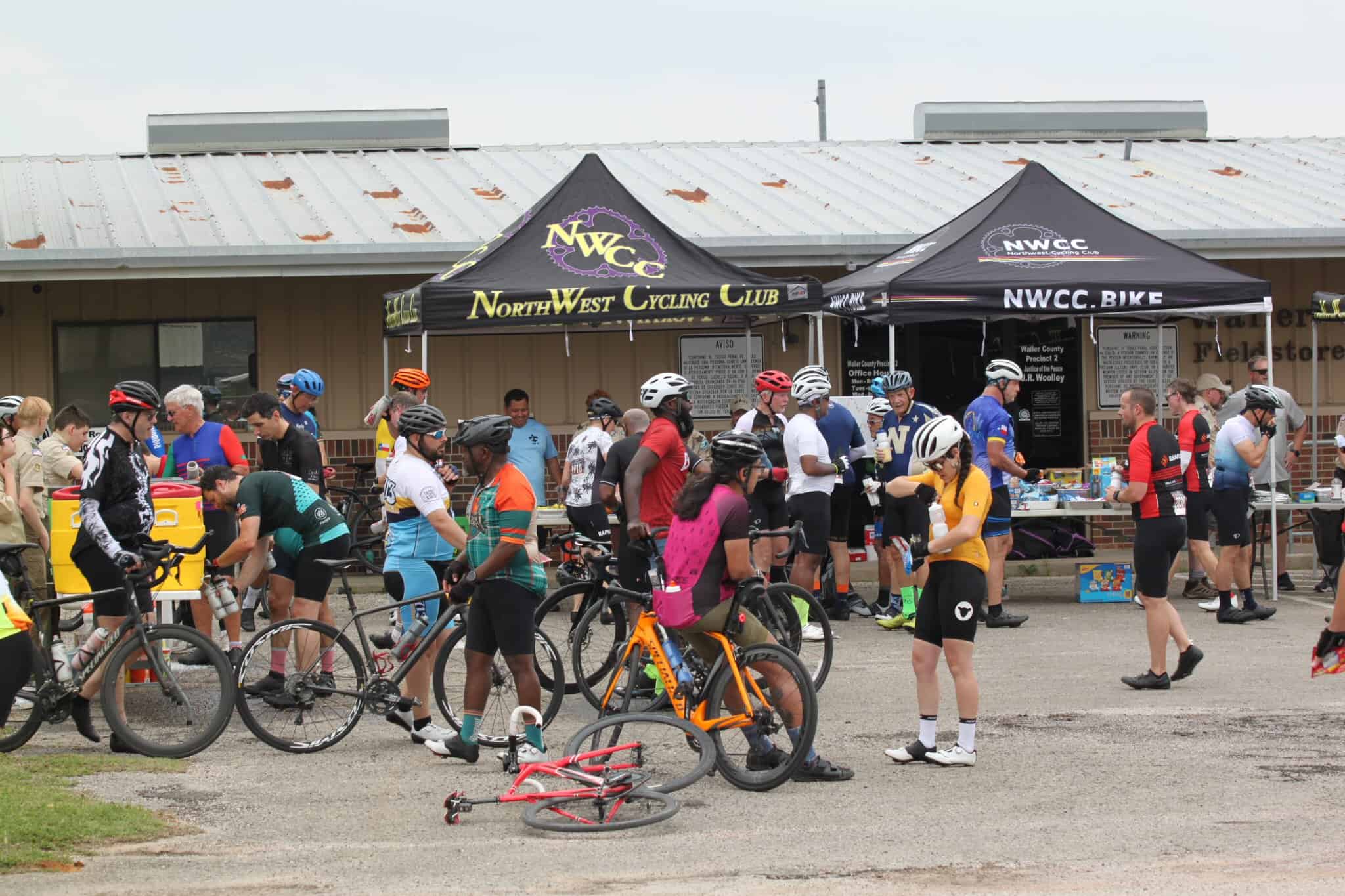 Bicycle event at NorthWest Cycling Club, Bluebonnet Express, outdoor cycling gathering, bike riders, support tents, community cycling race.