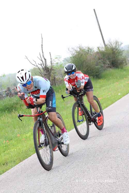 Riders racing on the Bluebonnet Express bike route during cycling event.
