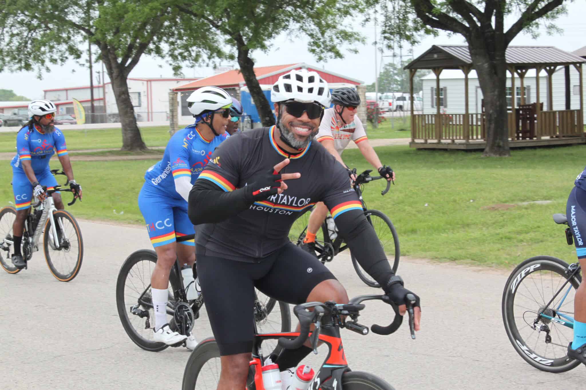 Vibrant cycling group participating in Bluebonnet Express bike event in Texas park.