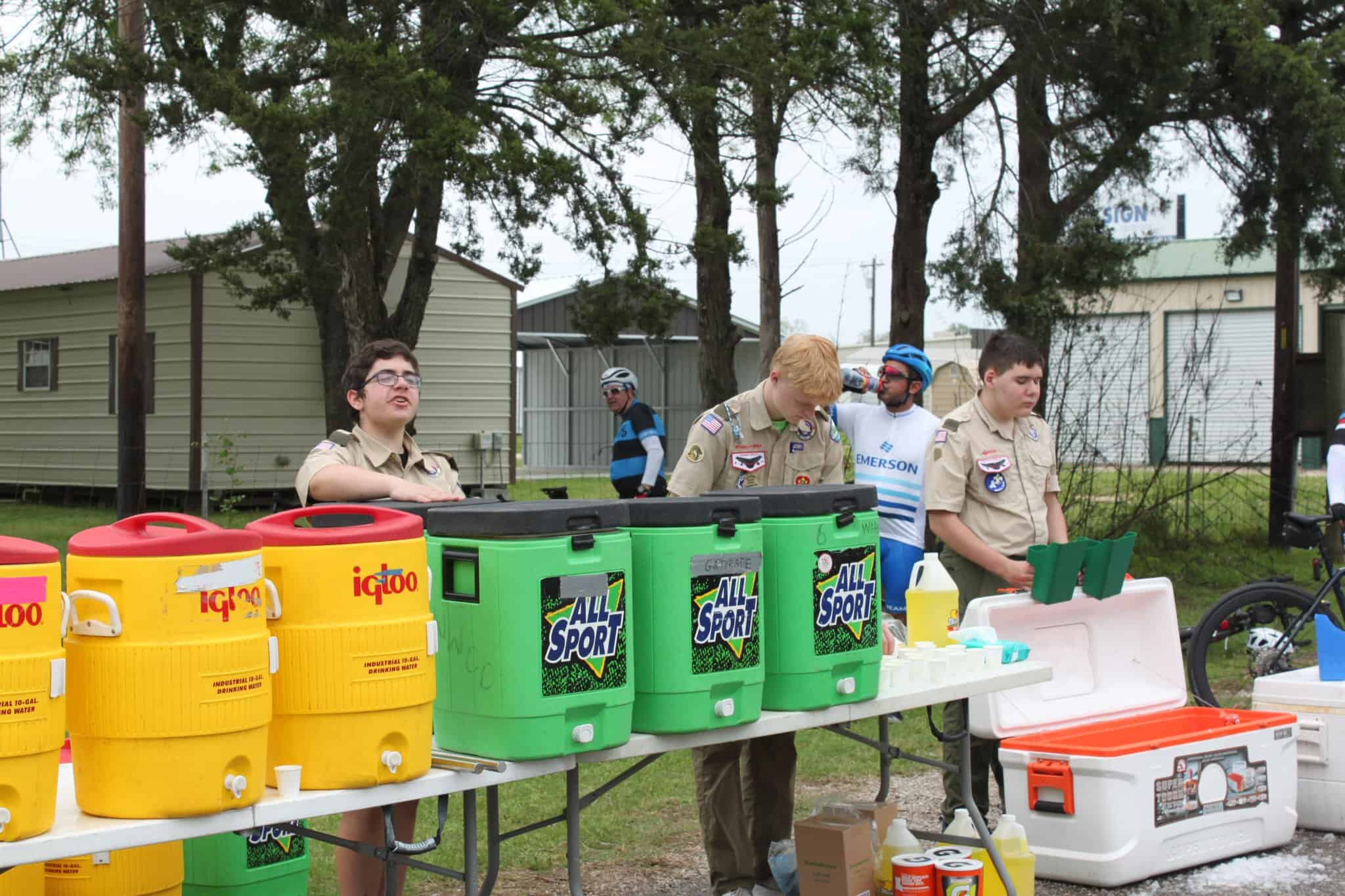 Colorful cooler display at a Boy Scouts event promoting outdoor adventure and hydration.