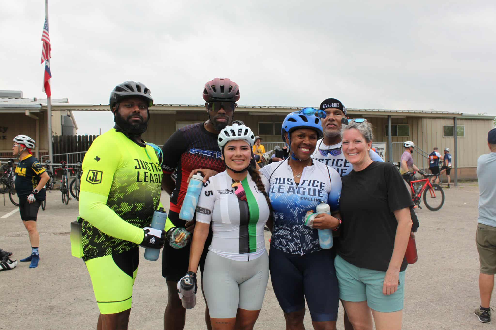 Vibrant cyclists celebrating after the Bluebonnet Express bike race event.