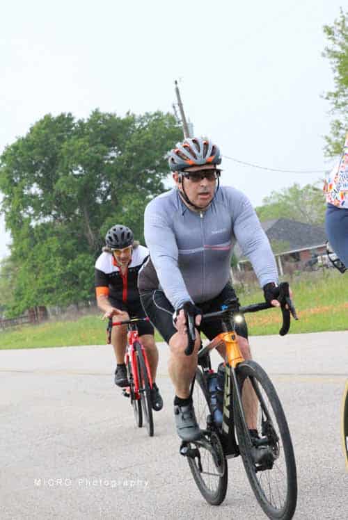 High-energy cycling event with Bluebonnet Express participants riding on scenic roads.