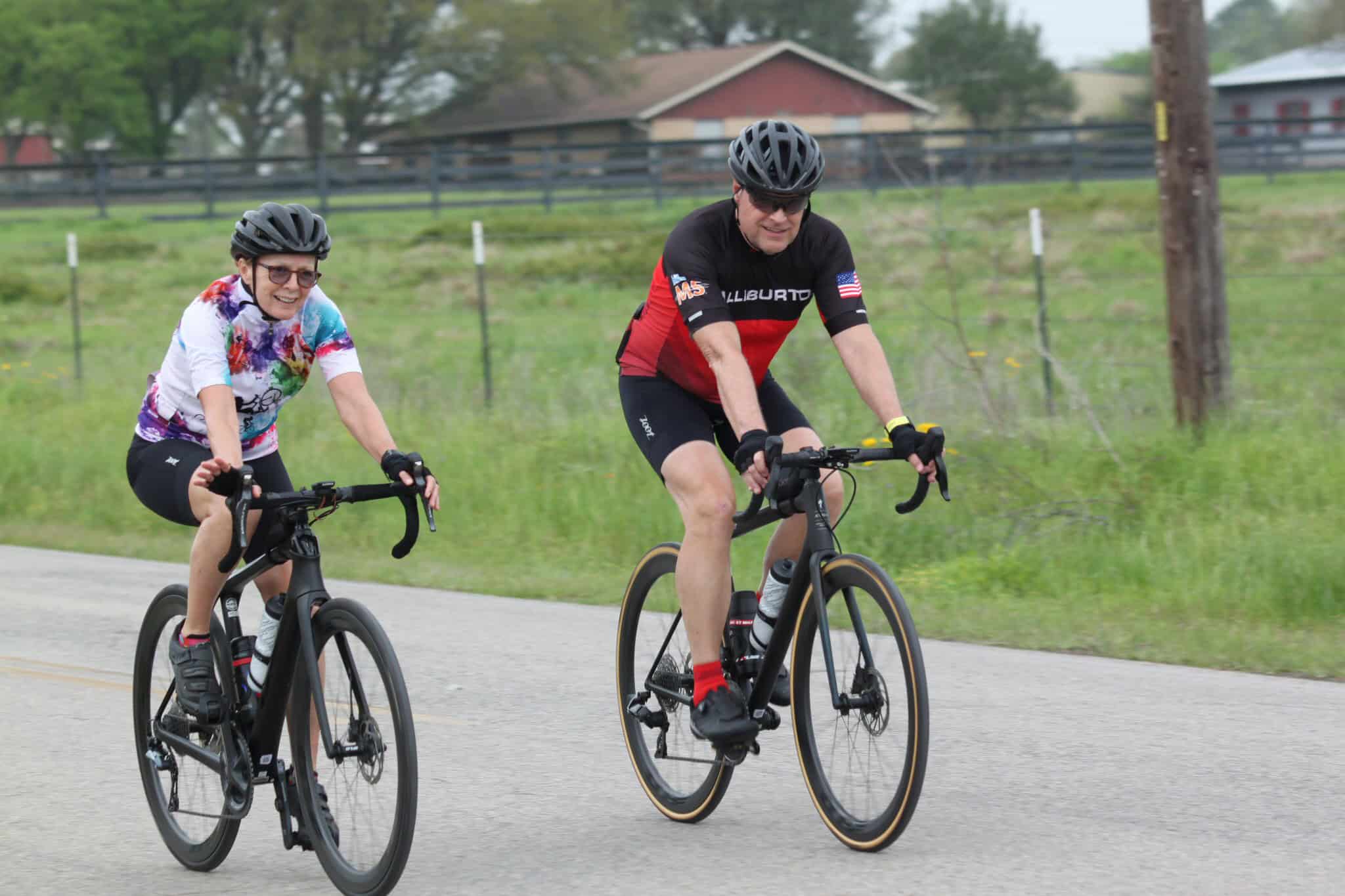 Eco-friendly cycling on Bluebonnet Express bike trail with smiling cyclists Road biking adventure in natural scenic environment.