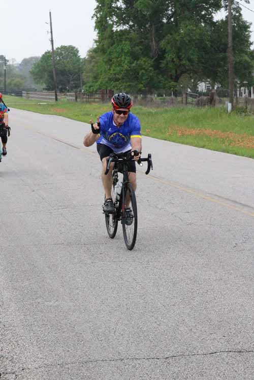 Enjoying a scenic bike ride in peaceful surroundings on Bluebonnet Express route.