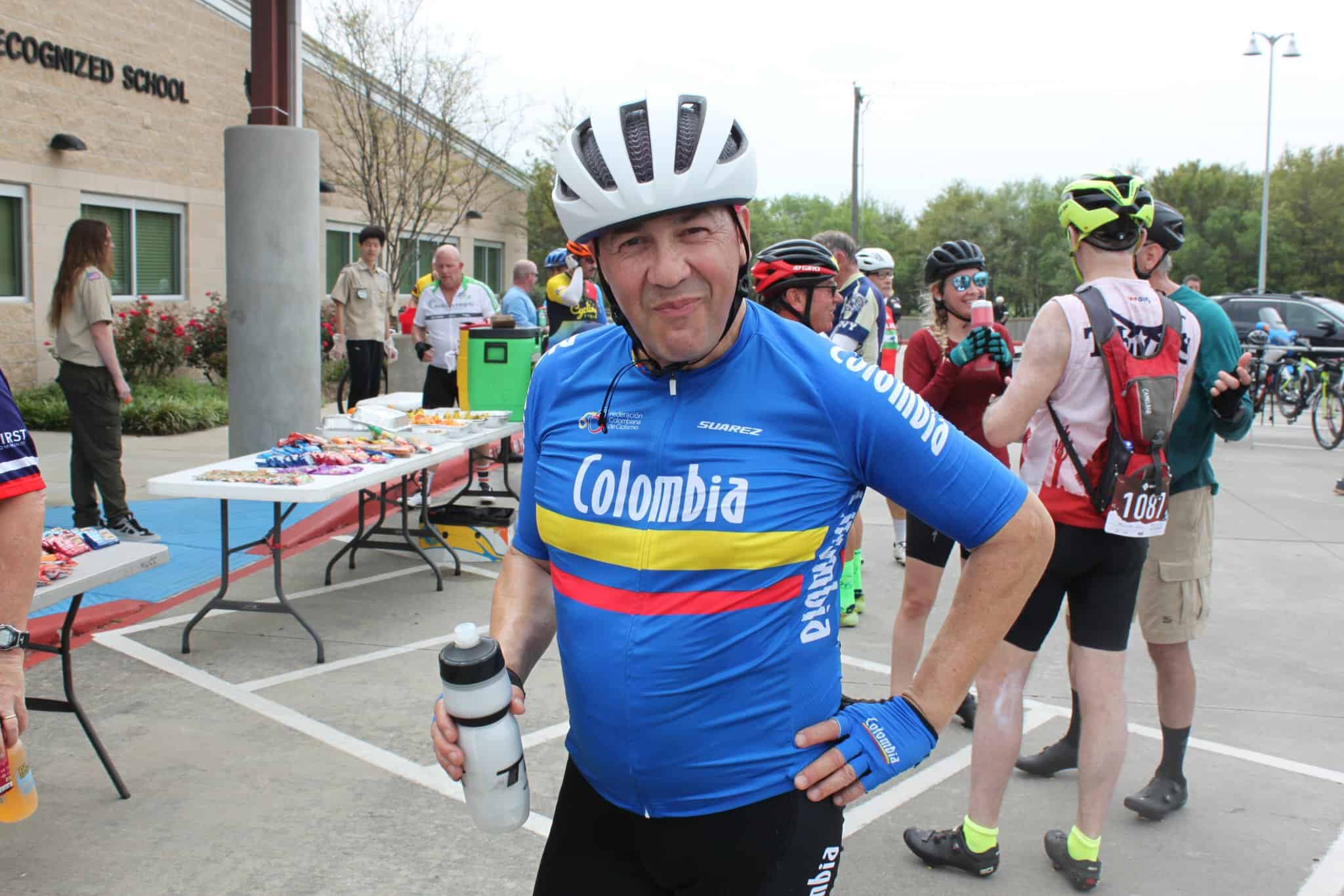 Cycling event at Bluebonnet Express in Texas, featuring Colombian cyclist with hydration bottle.