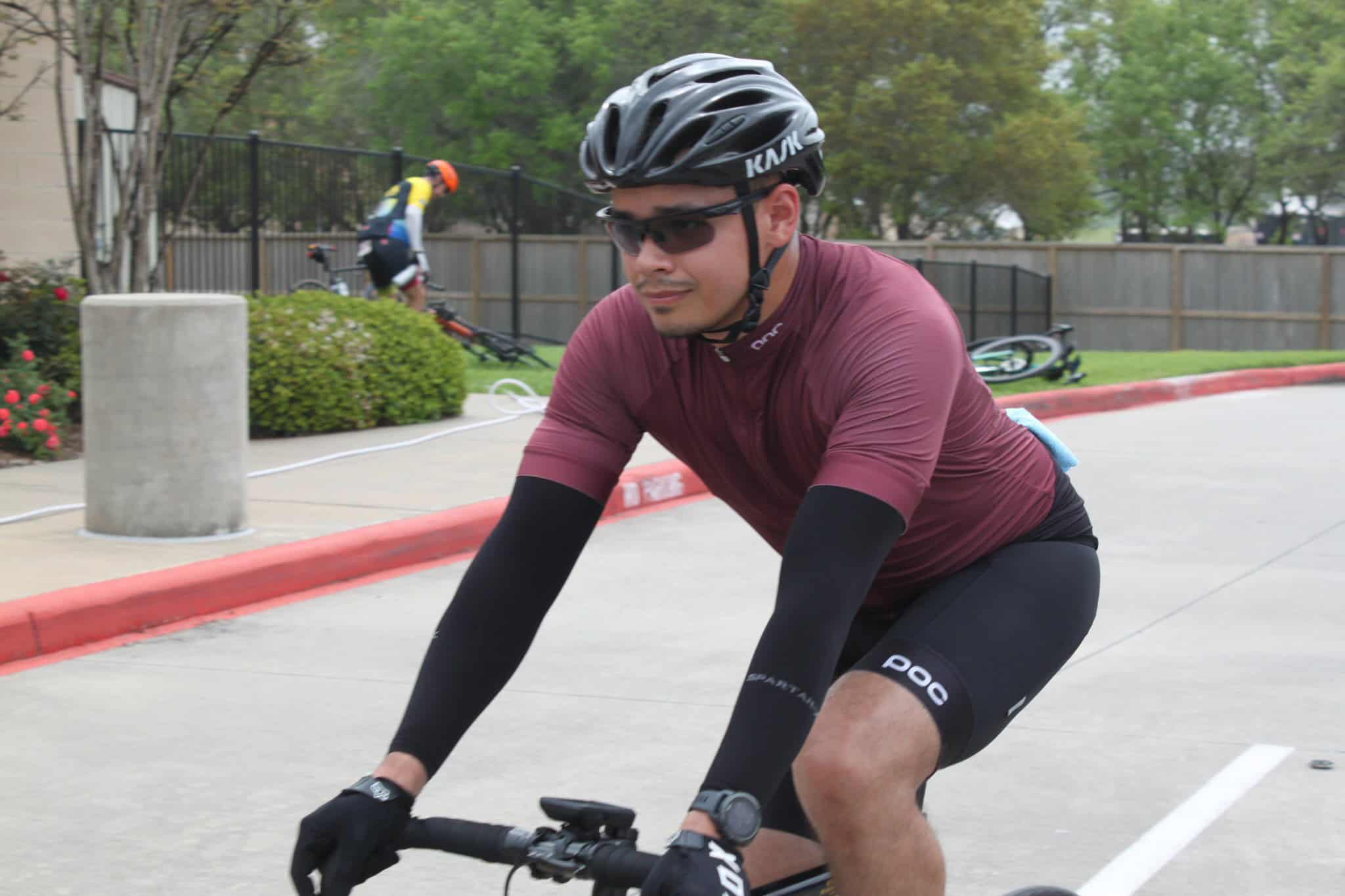 Vibrant cyclist riding a Bluebonnet Express bike, showcasing eco-friendly transportation and bike-sharing in urban areas.