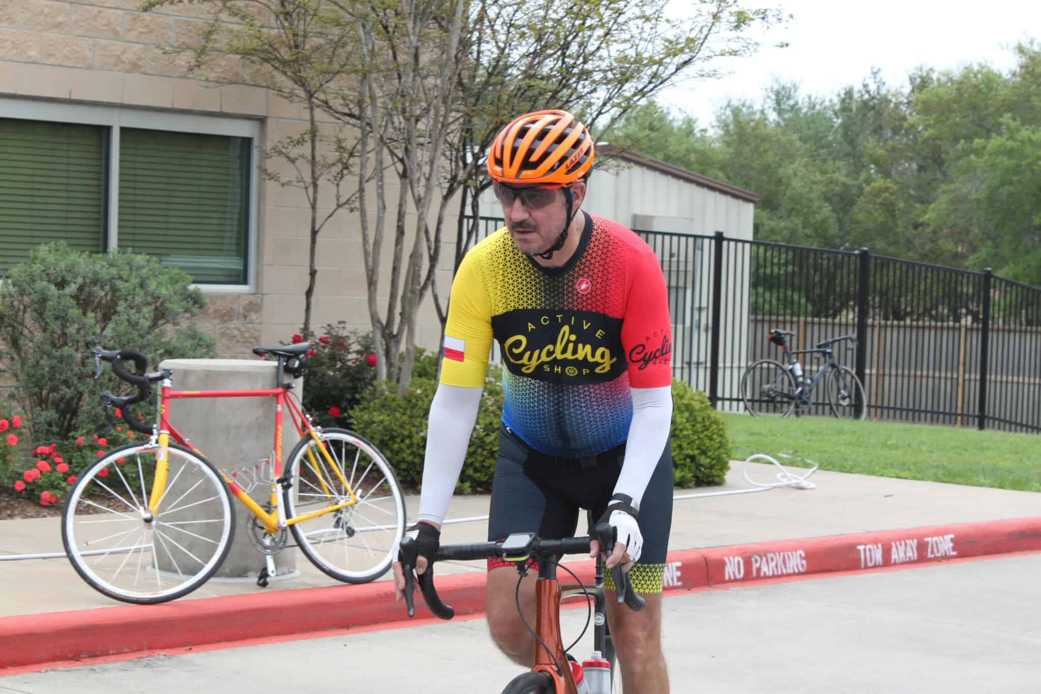 Vibrant cycling attire on male cyclist during outdoor ride, Bluebonnet Express bike event, active cycling sports.